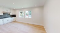 This contemporary 1-bedroom apartment in Winnetka, CA offers 490 square feet of efficiently designed living space. The open-concept floor plan maximizes the use of space, creating a seamless flow between the living areas. The kitchen is a standout feature, boasting crisp white cabinetry, stainless steel appliances, and a sleek gray backsplash. The bathroom showcases a modern aesthetic with a glass-enclosed shower, marble-look tiles, and a wooden vanity.

The 120-square-foot bedroom provides ample space and is illuminated by natural light from a large window. Throughout the apartment, light wood flooring adds warmth and complements the bright white walls, creating an airy ambiance. Recessed lighting fixtures contribute to the contemporary feel.

Large windows in the living area and kitchen allow plenty of natural light to flood the space, enhancing the sense of openness. The apartment also includes a convenient in-unit laundry area. With its thoughtful design and high-quality finishes, this apartment offers a stylish and comfortable living environment in a compact footprint.