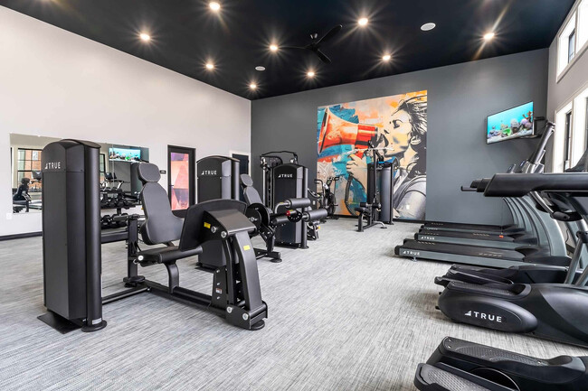 Experience the ultimate workout in this fully-equipped, stylish fitness center. - Colony Lofts