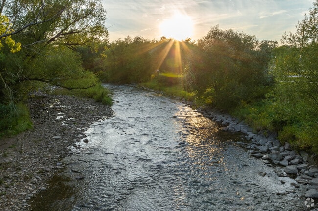 Watch the sun set over the Menomonee river in Wauwatosa.