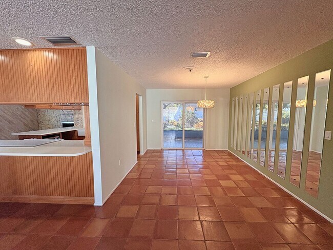 Building Photo - 3 Bed 2 Bath Home with Large Fenced Backyard & Screened Lanai — Available Now