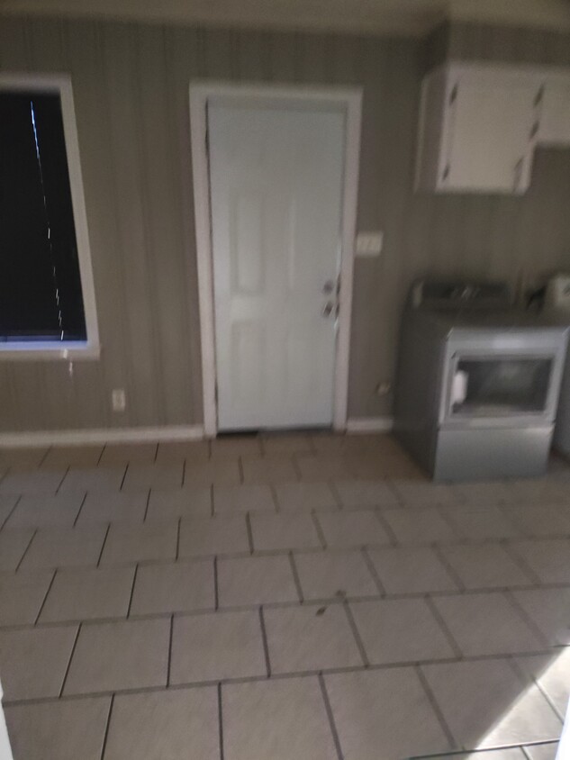 Building Photo - Quiet and Central Located large Yard Brick...