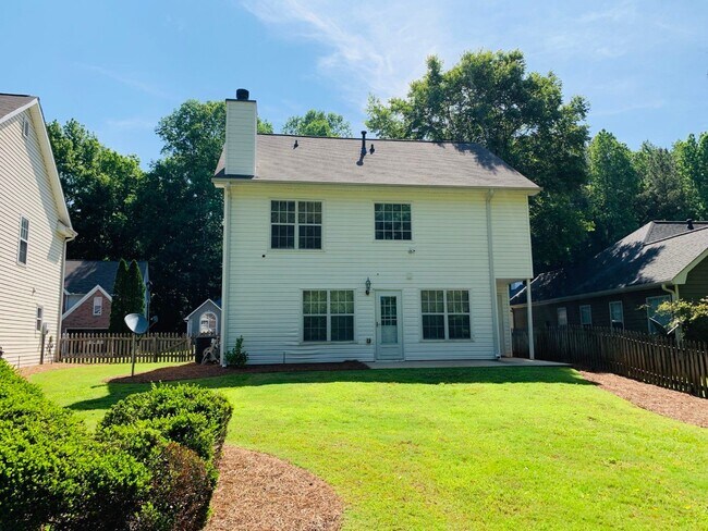 Photo - Great location! Lawncare/water is included... House