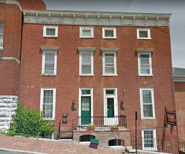 Outside front view, townhouse is on the left side of building. - 27 N New St