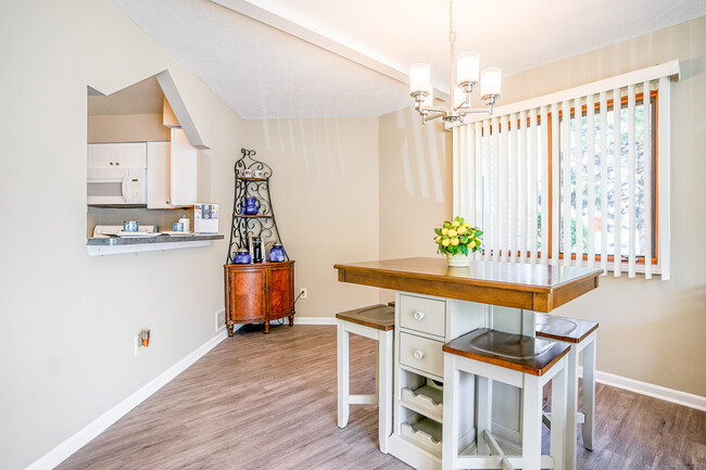 Dining Area with Pass-Through / Breakfast Bar in Townhome - Corn Hill Townhouses & Apartments