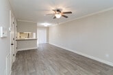 Located at 170 Willow Bend Ct in Kernersville, NC, this two-story home offers a practical and well-organized layout across both levels. The main floor features a living area finished with wood-style luxury vinyl plank flooring, crown molding, and a textured ceiling. A ceiling fan and access to an adjacent room add to the functionality of this space, which also benefits from a sliding door that brings in natural light.

The kitchen is equipped with warm-toned oak cabinetry, granite-style countertops, and a tile floor. Stainless steel appliances include a range, microwave, and dishwasher. A peninsula with a built-in sink provides additional prep space and connects the kitchen to the main living area.

The bedrooms are located on the upper level and feature plush carpeting, ceiling fans, and windows that allow natural light. The neutral wall tones throughout create a cohesive and calm atmosphere.

Bathrooms include oak vanities with white countertops and large mirrors. One full bathroom features a tub/shower combo with tile flooring, while an additional bathroom provides a simpler vanity setup. Overall, the home presents a clean, functional design suited for comfortable everyday living.