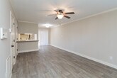 Located at 170 Willow Bend Ct in Kernersville, NC, this two-story home offers a practical and well-organized layout across both levels. The main floor features a living area finished with wood-style luxury vinyl plank flooring, crown molding, and a textured ceiling. A ceiling fan and access to an adjacent room add to the functionality of this space, which also benefits from a sliding door that brings in natural light.

The kitchen is equipped with warm-toned oak cabinetry, granite-style countertops, and a tile floor. Stainless steel appliances include a range, microwave, and dishwasher. A peninsula with a built-in sink provides additional prep space and connects the kitchen to the main living area.

The bedrooms are located on the upper level and feature plush carpeting, ceiling fans, and windows that allow natural light. The neutral wall tones throughout create a cohesive and calm atmosphere.

Bathrooms include oak vanities with white countertops and large mirrors. One full bathroom features a tub/shower combo with tile flooring, while an additional bathroom provides a simpler vanity setup. Overall, the home presents a clean, functional design suited for comfortable everyday living.