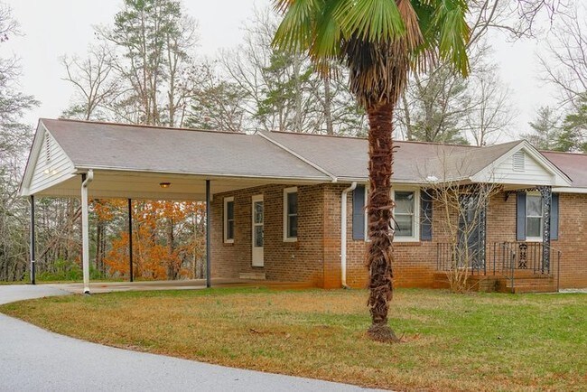 Building Photo - Beautiful Brick Home with Garage and Carport!