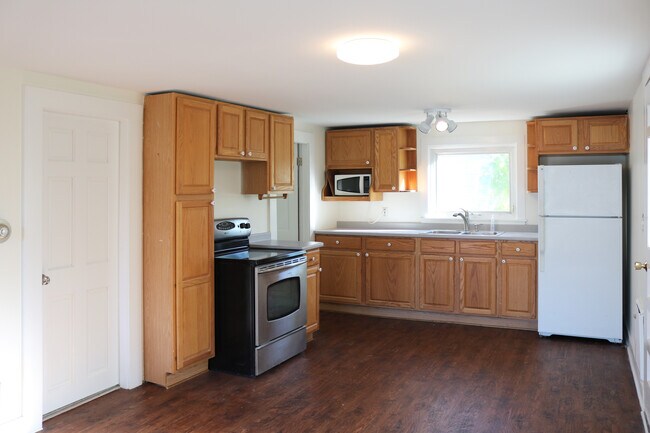 Open concept kitchen/living area with new flooring. - 34A Royal Ave