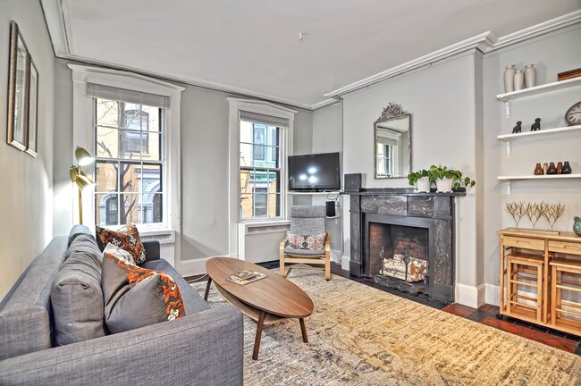 Living area with large street facing windows - 103 Myrtle St