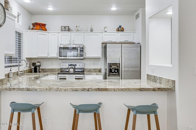 Foto del edificio - 9100 E Raintree Dr