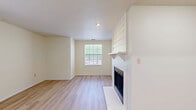 Located at 3200 Chestnut Ridge Drive in Pittsburgh, PA, this single-floor, 2-bedroom, 1-bathroom home offers a thoughtfully organized layout with a welcoming sense of space throughout. The living room serves as the heart of the home, featuring light hardwood-style flooring, a striking white shiplap fireplace surround, recessed lighting, and a window that brings in natural light and outdoor views. The kitchen is well-equipped with white shaker-style cabinetry, light granite-style countertops, stainless steel appliances including a refrigerator, range, microwave, and dishwasher, all set over durable light-toned flooring. The two bedrooms are carpeted for warmth and comfort, each offering windows with outdoor views and generous closet access — with three closets total across the unit providing excellent storage. A ceiling fan is featured in the primary bedroom. The full bathroom is clean and functional, with a tub-shower combination, white vanity, and light wood-style flooring. A dedicated laundry area and a connecting hallway complete this efficient and move-in-ready floor plan, making it a practical and comfortable home in the Pittsburgh area.