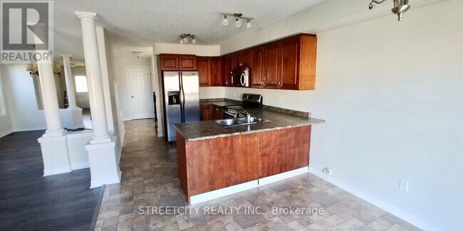 Photo du bâtiment - 200 Purple Sage Crescent