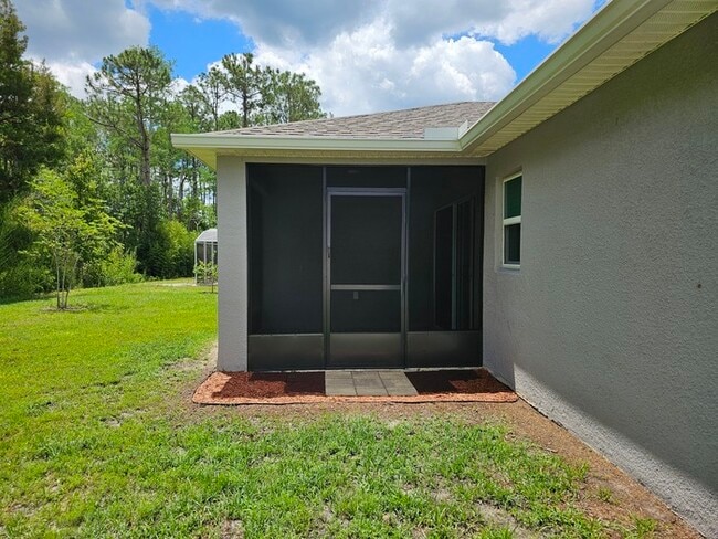 Building Photo - Beautiful 4/2 Home in Palm Coast Screened ...