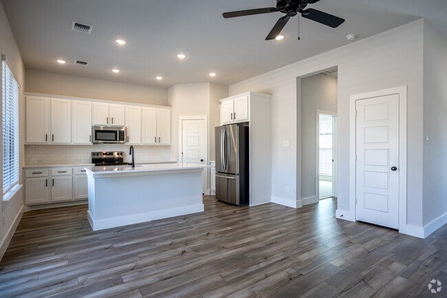 1BR, 1BA - 746SF - Living/Kitchen - Canopy Homes at Woodcreek