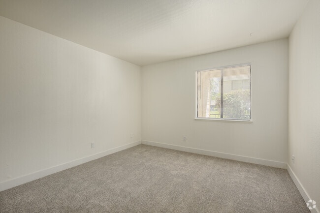 2BR, 1BA - 872SF - Primary Bedroom - Lakeside Village
