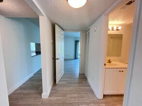 Hallway + Bathroom - Sailpoint Bay Apartments