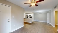 Located at 2350 Cypress Pond Road in Palm Harbor, FL, this well-appointed one-bedroom, one-bathroom residence offers a thoughtfully designed single-floor layout with modern updates throughout. Wood-look flooring flows consistently across the living spaces, complementing the neutral gray tones that define the interior palette.

The open-concept kitchen and living area serves as the heart of the home. The kitchen features a large peninsula with a white quartz countertop and an undermount sink, white shaker-style cabinetry, and a full suite of stainless steel appliances including a refrigerator, range, microwave, and dishwasher. A stacked washer and dryer unit is also conveniently integrated into the space. The living area is brightened by a sliding glass door that opens to a private balcony with outdoor views, and a ceiling fan enhances comfort.

The bedroom is a well-proportioned retreat with a ceiling fan, natural light from a window, and direct access to a hallway leading to the bathroom and closet. The bathroom is clean and functional, featuring a white vanity with quartz countertop, a tiled shower-tub combination, and wood-look tile flooring. A dedicated closet and hallway complete the layout, offering practical storage and circulation throughout the residence.