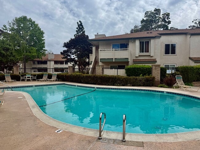Building Photo - Move in Ready! 2BD Townhome! New Carpet! Two Patio Spaces! Attached Garage!
