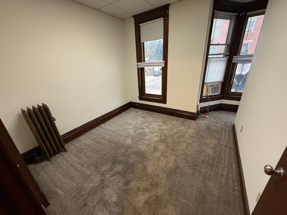 Primary Photo - Spacious 4-Bedroom Apartment with Main Street Views