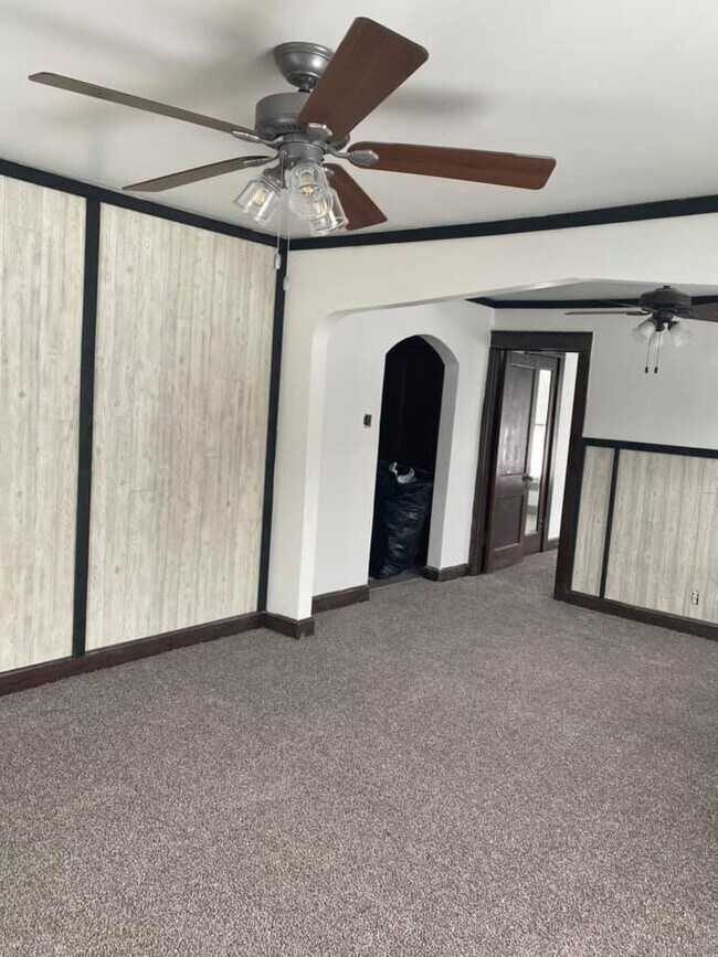 View from LR to DR. Door leads to Front Bedroom Arch leads to rest of apartment - 1173 W Pleasant St