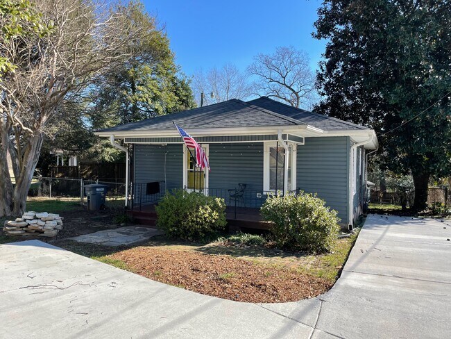 Street view of front with spacious paved driveway. - 1202 E. Catawba St.