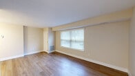 Located at 4809 Columbia Rd in North Olmsted, Ohio, this well-appointed one-bedroom, one-bathroom unit offers a comfortable and efficient single-floor layout. Warm-toned, hardwood-style flooring runs consistently throughout, lending a cohesive and polished look to every room.

The living and dining areas are open and filled with natural light courtesy of large windows fitted with horizontal blinds. Neutral beige walls and clean white baseboards create a bright, welcoming ambiance. A floor vent heating system ensures year-round comfort.

The galley-style kitchen is thoughtfully designed with an abundance of white shaker cabinets featuring brushed nickel hardware, light stone countertops, stainless steel appliances including a refrigerator and range, and a stainless steel sink — maximizing both function and style in the space.

The spacious primary bedroom accommodates a generous footprint and includes a window with outdoor views, providing natural light and ventilation. Three closets — including a walk-in with dual wire shelving systems — offer exceptional storage capacity.

The bathroom features a white vanity with a framed mirror, brushed nickel fixtures, a light stone countertop, and an accessibility grab bar. A utility room and hallway round out the thoughtfully organized layout of this move-in-ready unit.