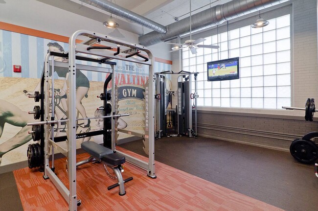 Modern fitness center with professional strength training machines - Ovaltine Court