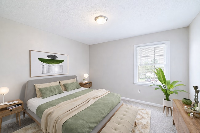 Serene neutral bedroom with sunlight - Blue Ridge Apartments