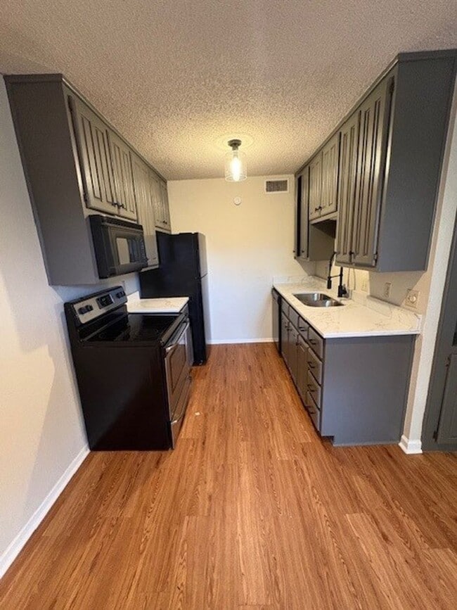 Building Photo - Modern 2BR/2BA Condo – Newly Remodeled Kitchen & Prime Location!