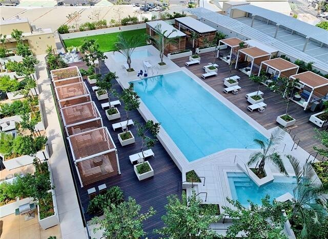 View of the Level 8 pool, Jacuzzi and cabana amenities deck from the lanai - 987 Queen St