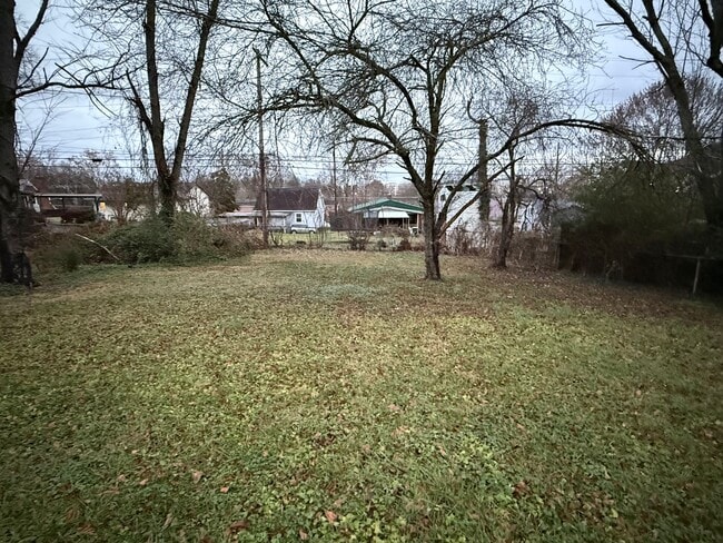 Building Photo - Updated 4BR Home with Finished Basement & Level Yard