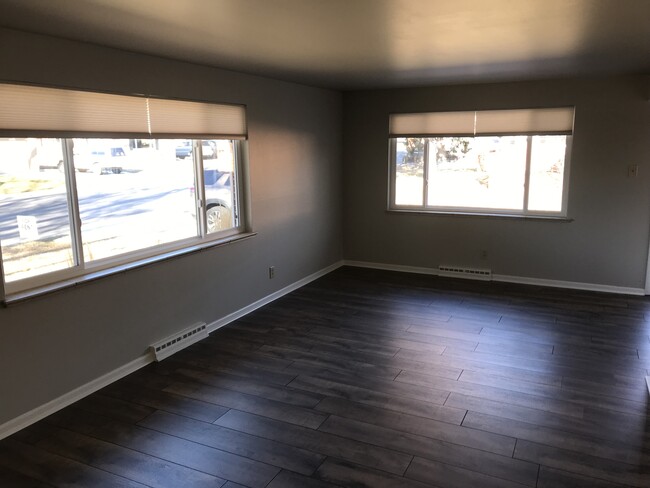 Large living room/front room. Lots of light! - 6140 Dudley St