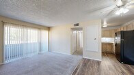 Located at 121 Kokomo St in Colorado Springs, Colorado, this single-floor, 3-bedroom, 1-bathroom home offers a practical and efficiently arranged layout. The living room serves as the central gathering space, featuring a combination of carpet and wood-look flooring, warm neutral-toned walls, a textured ceiling, and a ceiling fan. It flows openly toward the kitchen, which is equipped with light wood cabinetry, white countertops, a stainless sink, and black appliances including a refrigerator and dishwasher, all set atop wood-look flooring. The three bedrooms are carpeted throughout and bathed in natural light from windows fitted with vertical blinds. Each bedroom features neutral walls and a textured ceiling, with select rooms offering built-in bifold closets for ample storage. The primary bedroom provides a comfortable, well-proportioned retreat. The shared full bathroom includes a tub-shower combination, a toilet, and warm wood-look flooring, presenting a clean and functional design. A central hallway connects all rooms efficiently. Textured ceilings are consistent throughout the home, adding a classic touch to the overall interior character.