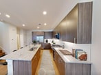 This contemporary residence in McKinney, Texas offers 1470 square feet of thoughtfully designed living space across two floors. The home boasts 2 bedrooms and 4 bathrooms, providing ample space for comfortable living and entertaining.

The ground floor, spanning 550 square feet, features an open-concept layout that seamlessly blends the kitchen, living, and dining areas. The gourmet kitchen is a highlight, showcasing sleek wooden cabinetry, stainless steel appliances, and a generous island with a granite countertop. Light wood flooring throughout the main living areas adds warmth and continuity.

Ascending to the 920-square-foot upper level, you'll find two bedrooms, including the expansive 230-square-foot primary suite. The bedrooms are carpeted for comfort and feature ceiling fans and large windows that bathe the spaces in natural light. The bathrooms are modern and well-appointed, with one showcasing a spacious walk-in shower, granite countertops, and wooden vanities.

The home's design prioritizes storage, with two dedicated closet spaces and a laundry room complete with full-sized washer and dryer units and overhead cabinetry. Throughout the property, recessed lighting and strategically placed windows ensure a bright, airy atmosphere.

Located on Pepperidge St in McKinney, this home combines modern amenities with practical design, offering a comfortable and stylish living environment in a desirable Texas location.