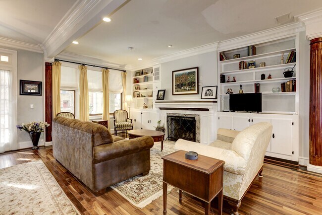 Living room with woodburning fireplace and built-ins! - 2643 Woodley Pl NW