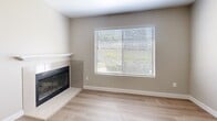 Located at 7541 Windbridge Dr in Sacramento's 95831 zip code, this single-floor, two-bedroom, one-bathroom home offers a well-organized layout with a functional mix of spaces. The living room serves as the heart of the home, featuring light wood-style flooring, neutral warm-toned walls, and a tile-surround fireplace with a white mantel — a standout architectural detail. A large window fitted with horizontal blinds allows natural light to fill the room and provides views of the outdoor greenery.

The kitchen is thoughtfully updated with white shaker-style cabinetry, light stone countertops, a stainless steel range, and an under-cabinet range hood. A sizable window overlooks the outdoors, keeping the space bright and airy. The light wood flooring continues seamlessly from the living area into the kitchen.

Both bedrooms are carpeted and feature neutral walls, sliding-door closets with hanging rods, and windows with blinds that let in natural light. The primary bedroom offers a generous footprint with ample closet space.

The bathroom is clean and efficiently laid out, featuring a white vanity with stone countertops, black hardware accents, a tub/shower combination, and light wood-style flooring that ties the space together with a cohesive, modern feel.