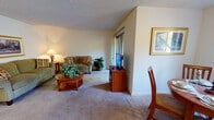 This single-story residence at 3499 Cortese Cir in San Jose, California, offers a well-organized layout designed for comfortable everyday living. The living room serves as the central gathering space, featuring wall-to-wall carpet, a textured ceiling, and a sliding glass door that allows natural light to filter in. The room accommodates a seating arrangement centered around a round wooden coffee table, with framed wall art adding a finishing touch.

Adjacent to the living area, the dining space features a ceiling fan with integrated lighting, a sliding window with outdoor greenery views, and room for a four-person dining set. The galley-style kitchen is efficiently laid out with warm wood cabinetry lining both sides, light stone-tone countertops, tile flooring, and white appliances including a range, refrigerator, and dishwasher.

The bedrooms are carpeted and well-proportioned, each offering closet access. The primary bedroom includes a sliding glass door leading to an outdoor area with wooded views. Both bathrooms feature tub-shower combinations with tiled surrounds, vanities with warm-toned countertops, and tile flooring, providing a clean and functional design throughout.