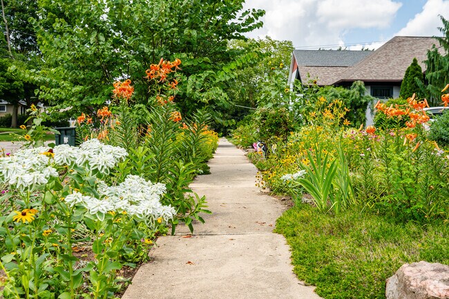 Crystal Lake sidewalks are adorned with blooming flowers.