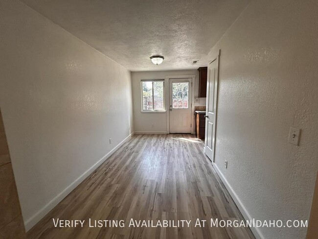 Building Photo - Quick interstate access, wood floors, cove...