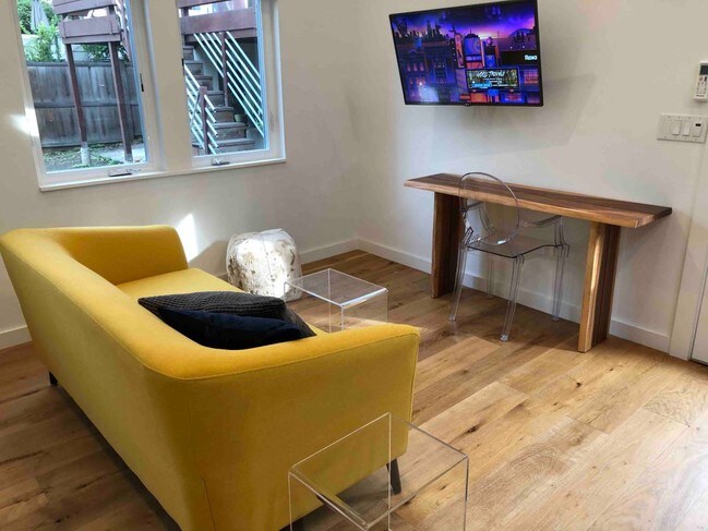 Living space with TV and Roku player - 2732 Claremont Blvd
