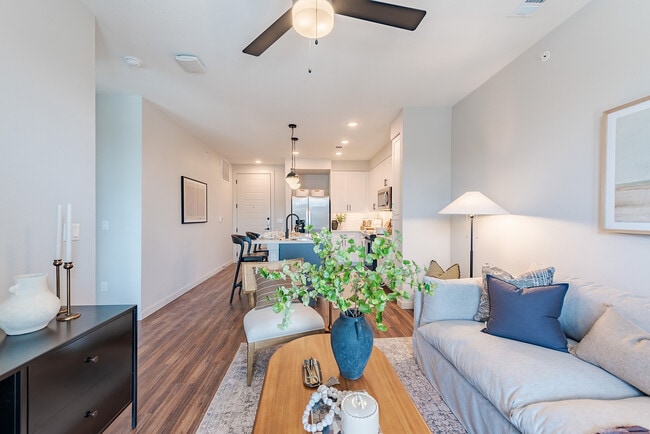 Living Room with Hardwood-Style Flooring - Tisdale at Lakeline Station Apartments