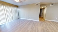 This well-designed apartment in Temple Terrace, FL, offers 810 square feet of contemporary living space. The open floor plan features two bedrooms and two bathrooms, with the primary bedroom boasting a generous 180 square feet. The modern kitchen is a highlight, showcasing white cabinetry, granite countertops, and stainless steel appliances, including a refrigerator, stove, and built-in microwave.

Throughout the apartment, light-toned wood-look flooring creates a warm and inviting atmosphere. The living areas are enhanced by neutral-colored walls, providing a blank canvas for personalization. Large windows and sliding glass doors in the bedrooms allow for ample natural light, while ceiling fans offer additional comfort.

The bathrooms are outfitted with modern fixtures, including granite vanity tops and tiled shower/tub combinations. The apartment also features a convenient in-unit closet for additional storage. The overall design emphasizes functionality and style, making efficient use of the available space while maintaining an open, airy feel. This Seastone apartment presents an ideal blend of comfort and contemporary living in a prime Florida location.