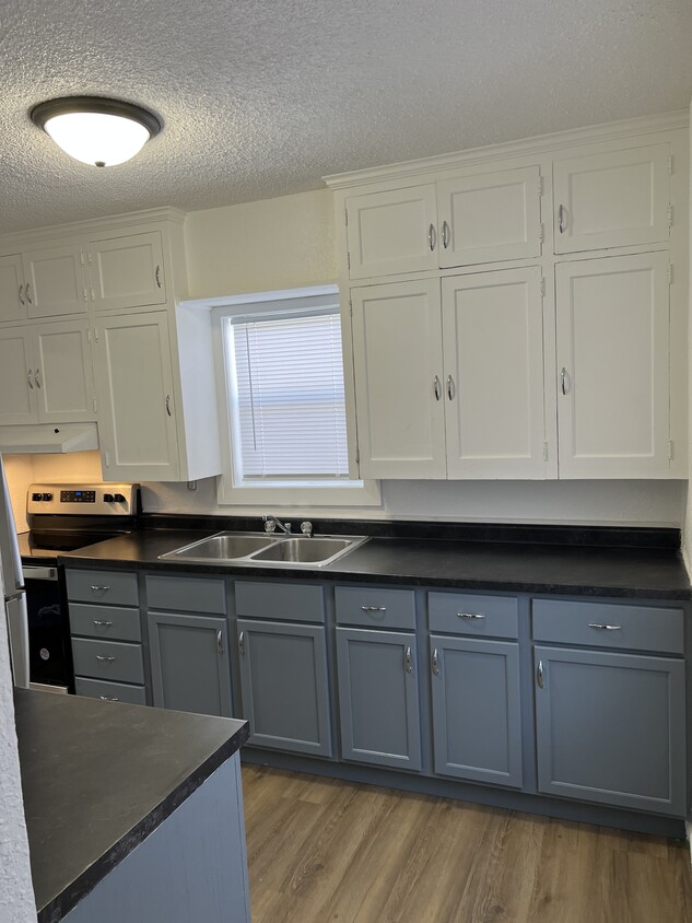 kitchen w/ new lower cabinets - 112 14th St S