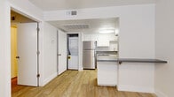Located at 15082 N 59th Ave in Glendale, Arizona, this well-designed one-bedroom, one-bathroom residence offers a smart and functional layout across a single floor. Light-toned wood-look flooring runs throughout, creating a cohesive and clean aesthetic from room to room.

The kitchen is a standout feature, outfitted with crisp white cabinetry, grey countertops, and a full suite of stainless steel appliances including a refrigerator and dishwasher. A peninsula provides additional prep and dining space, while a built-in flush ceiling light keeps the area bright. Notably, an in-unit stacked washer and dryer is tucked neatly into a dedicated closet just off the kitchen, adding exceptional convenience.

The living area is open and airy, benefiting from natural light and a clean, neutral palette that makes the space feel welcoming. The bedroom is comfortably sized, featuring a ceiling fan, window with blinds, and direct access to a walk-in closet complete with built-in shelving and hanging rods for ample storage.

The bathroom is clean and straightforward, featuring a full soaking tub with an overhead shower, chrome fixtures, and bright white surroundings. Throughout the unit, white walls and trim contribute to a fresh, move-in-ready feel well suited for comfortable single-occupant living in the Glendale area.