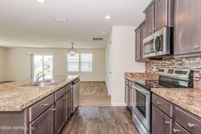 Building Photo - 15697 Saddled Charger Dr