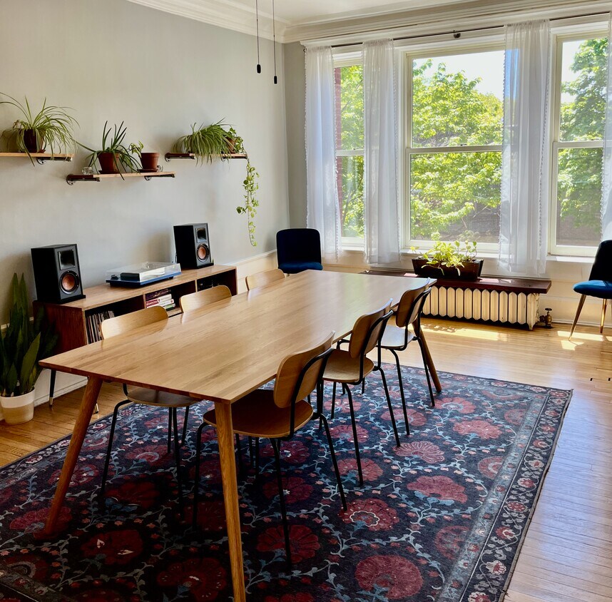 The dining room is spacious and filled with natural light from south-facing windows. - 5142 S Greenwood Ave
