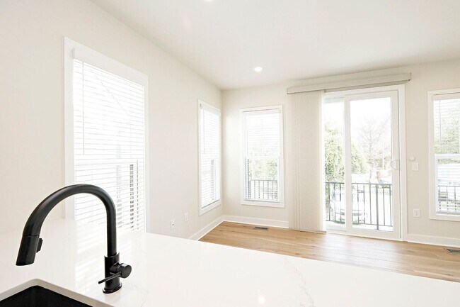 Building Photo - $1,000 Move-in Special! Brand New Belmont Apartment With Oversized Garage