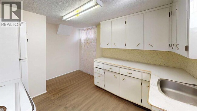 Photo du bâtiment - 1212-1217 7 Ave S