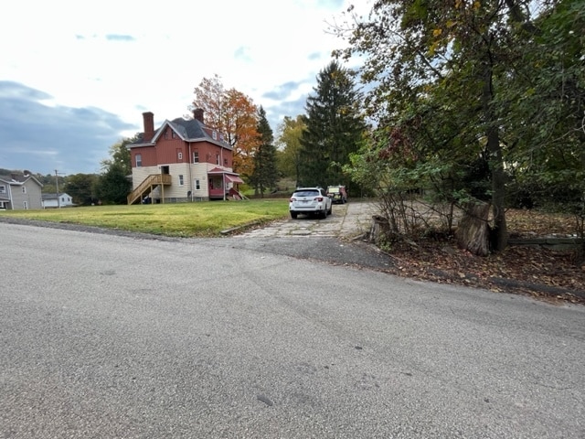 Exterior with huge yard and parking pad. - 433 Herschel St