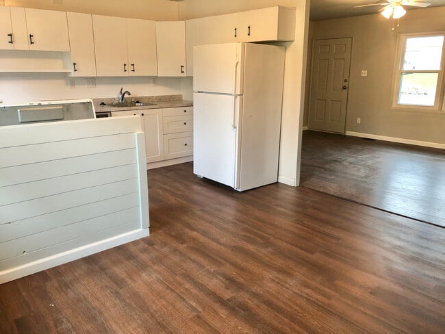 view from dining area into kitchen and living - 1824 Miller Dr